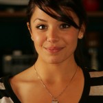 Enlarged pupils says that a woman is aroused and liking what she is seeing.