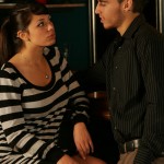 Sitting shows that she is willing to be lead.